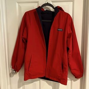 Reversible water resistant rain jacket. Red/ navy